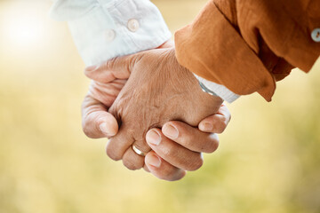 Wall Mural - Holding hands, love and senior couple closeup outdoor in garden together for bonding or retirement. Peace, support or trust with elderly man and woman in garden or park for dating or romance