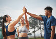 © Fanti/peopleimages.com - Fitness, happy and people high five in nature for goals for marathon training, exercise and workout. Friends, teamwork and men and women with hand gesture for wellness, competition and race outdoors