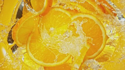 Canvas Print - Super Slow Motion of Falling Orange Slices into Water, Colored Background. Filmed on High Speed Cinema Camera, 1000 fps. Camera Tracking the Target.