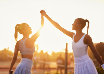 Wall Mural - High five, women and win on tennis court for fitness, success and sportsmanship at sunset. Girl team, hands together and celebrate for victory in sport, motivation and achievement in competition