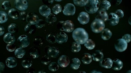Poster - Super slow motion of rotating blueberries on black background, top view. Filmed on high speed cinema camera, 1000 fps, placed on high speed cine bot. Speed ramp effect.