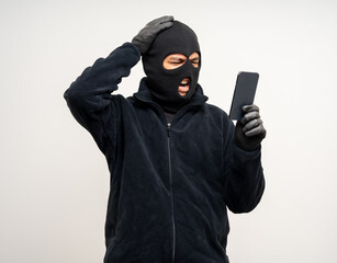 Wall Mural - Thief in uniform black jacket various pose on isolated background. The Robber terrorism criminal escapes with balaclava and crowbar entering a house for stealing Housebreak