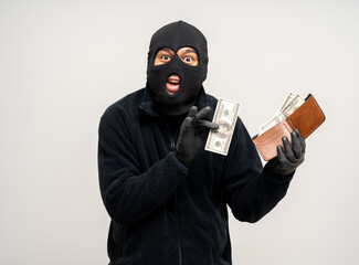 Wall Mural - Thief in uniform black jacket various pose on isolated background. The Robber terrorism criminal escapes with balaclava and crowbar entering a house for stealing Housebreak