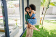 © lordn - Portrait of a young cheerful couple of African descent standing in a modern luxury villa, having an intimate moment of love and affection. Exotic and luxury travel concept.