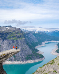 Wall Mural - Couple on a Cliffside in Norway, Trolltunga, Norway