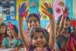 © PRASANNAPIX - Group of Indian playgroup kids age 2-3 years raise their colorful hands in classroom