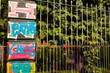© Bojan - Ghent, Belgium - 05.26.2024: A graffiti alley full of colors and colorful paintings in Ghent