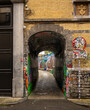 © Bojan - Ghent, Belgium - 05.26.2024: A graffiti alley full of colors and colorful paintings in Ghent