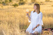 © Олег Мальшаков - Beautiful young girl with a glass of wine on a picnic