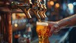 © Audtakorn - A bartender pouring a draft beer into a glass