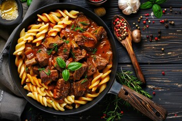 Wall Mural - Pasta with meat and mushrooms in a pan.