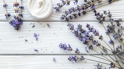 Wall Mural - Dried lavender flowers and cosmetic cream displayed on a white wooden table