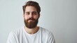 © AlfaSmart - A bearded man, casually dressed in a white T-shirt