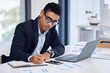 © AzeemudDeen/peopleimages.com - Writing, graph and business man on laptop for data analysis, financial chart and annual company report. Fintech, corporate and worker with notes on computer for research, finance review and planning