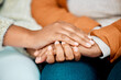 © DavisShared/peopleimages.com - People, holding hands and comfort in home for support, love and woman for empathy in life crisis together. Forgive, bonding gesture and affection for friends relationship, help and compassion