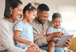 © DavisShared/peopleimages.com - Mother, children and dad with tablet on sofa for online activities, kids educational apps and digital storytelling. Mom, father and family home with internet for boy or girl, screen time and bonding.