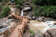 © debjit - picturesque foot bridge of the river gorge at lodh waterfalls inside 'palamou tiger reserve,' latehar, jharkhand, india