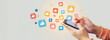 © PixPacks - Social media and digital online communication concept, man using smartphone with likes icons on social media. Banner background.