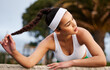 © peopleimages.com - Tired, tennis and woman with break at court for practice, competition or cardio workout. Headband, sports and athlete person with hairstyle for physical activity, tournament or rest after training