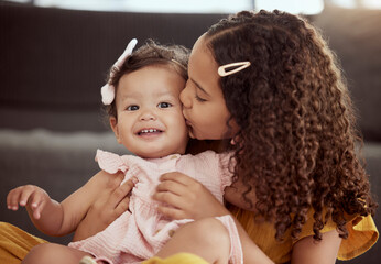 Wall Mural - Home, girls and sister with kiss in portrait for sibling connection, love and support in growth. Happy, toddler and kid with affection in living room for care, trust and bonding together on weekend