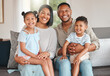 © DavisShared/peopleimages.com - Mother, father and children with portrait in house on sofa for love, care and support as people. Family, happy and smile in living room on couch for bonding, relax and retirement together on weekend