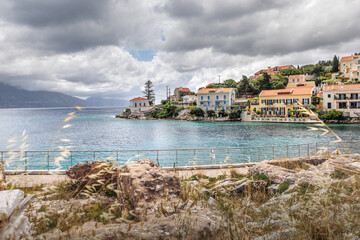 Fiskardo village on the Ionian Island of Kefalonia Greece, summer vacation destination, cloudy sky and beautiful landscape scenery