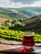 © imlane - glass turkish tea with red tea tea fields on background