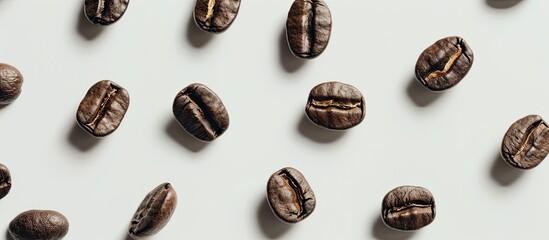 Fototapete - Coffee grains artfully arranged on a white backdrop with copy space image