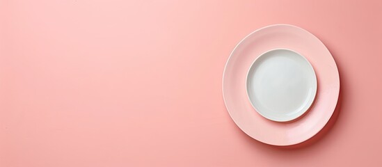 Poster - Pink background with copy space image featuring an empty plate