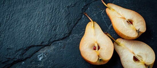 Fototapete - Morning breakfast concept displayed with a close up image of pear slices on a dark backdrop featuring a clear copy space