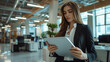 © Your Hand Please - thoughtful, beautiful businesswoman holding a tablet, dressed professionally, symbolizes intelligence, focus, and modern business dynamics