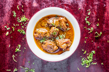 Beef Jhal Fry korma karahi or fried Beef curry served in bowl isolated on table background top view of bangladeshi, indian and pakistani food