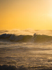 Wall Mural - Beautiful layer of wave breaking on the beach in the morning.