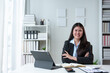 © crizzystudio - startup business idea Professional business woman leading a smiling female organization, female administrative manager with arms crossed, smiling happily inside the office.