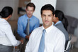 © Leffy/peopleimages.com - Portrait, leader and business man in meeting for coworking, career and job at workplace. Face, confident entrepreneur and professional sales manager, employee and worker with team at company office