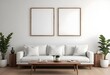 © Sharif54 - Minimalist living room with a large white sofa, wooden coffee table, and a blank framed wall art