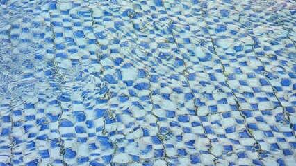 a blue and white checkered pattern in a pool