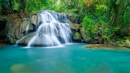 Wall Mural - Beauty in nature, amazing waterfall in tropical forest of national park, Thailand