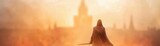 Silhouette of a cloaked figure wielding a sword, standing before a mysterious misty fortress at dawn, embodying fantasy and adventure.