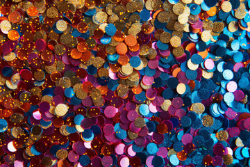 Wall Mural - vibrant colorful background with sparkling sequins in various colors. festive texture