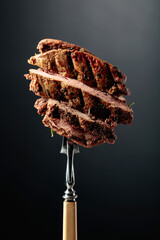 Wall Mural -  Beef steak on a fork.