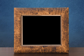 Canvas Print - frame on table, blue wall