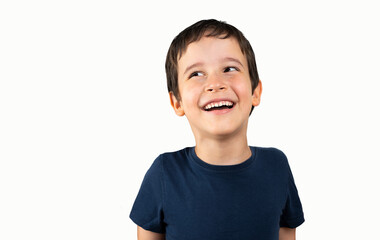 portrait of a young boy looking up on white background
