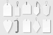 © Fotograf - A collection of blank tags suspended from a string, often used for organizing or displaying items