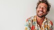 © Attasit - A man in a casual summer outfit, laughing joyfully against a white background, embodying a carefree spirit