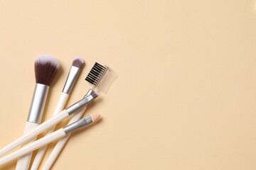 Poster - Cosmetic brushes on colored background. Set of makeup brushes