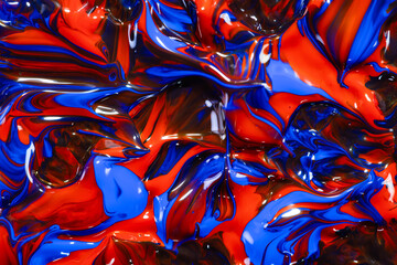 closeup of red and blue fluid paint with brush strokes textured background