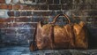 © peerawat - A vintage travel bag stands against an old brick wall, evoking a sense of nostalgia and timeless adventure.