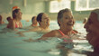 © VK Studio - Elderly women having a delightful time splashing and enjoying their swimming class in a warm, indoor pool.