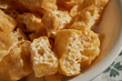 © Brian Yarvin - A bowl of fried, sliced tofu puffs, a classic Asian ingredient